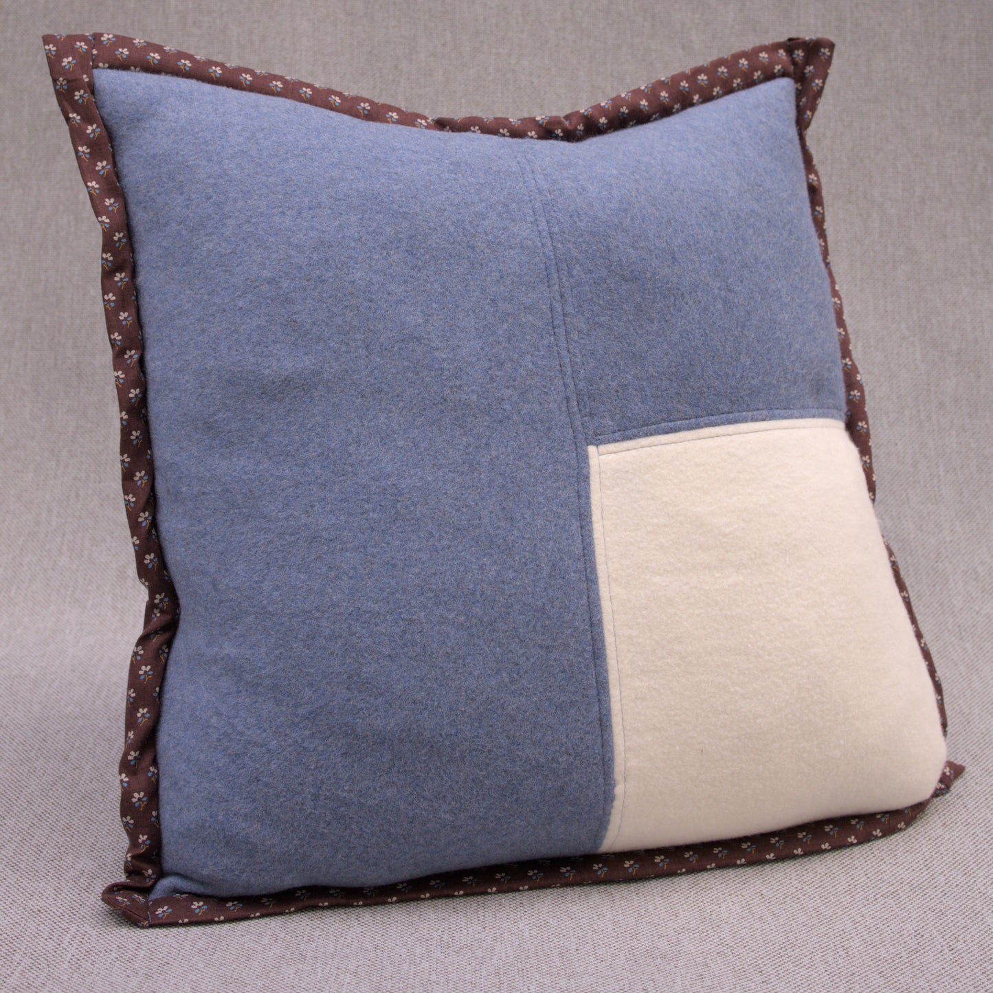 blue cotton fleece pillow with white fleece patch and brown japanese cotton border