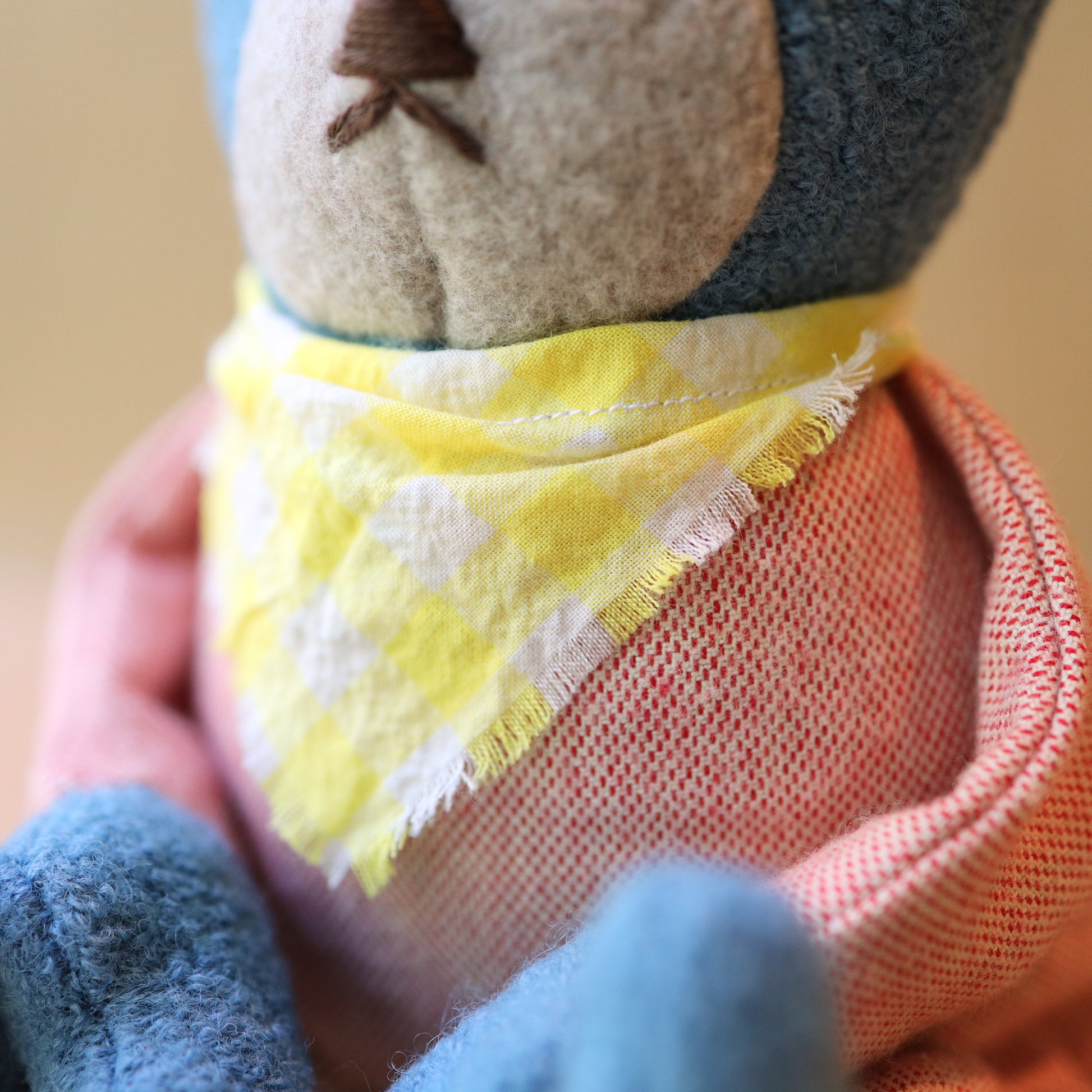 Berry the Floppy Teddy in peach pajamas and wool boucle