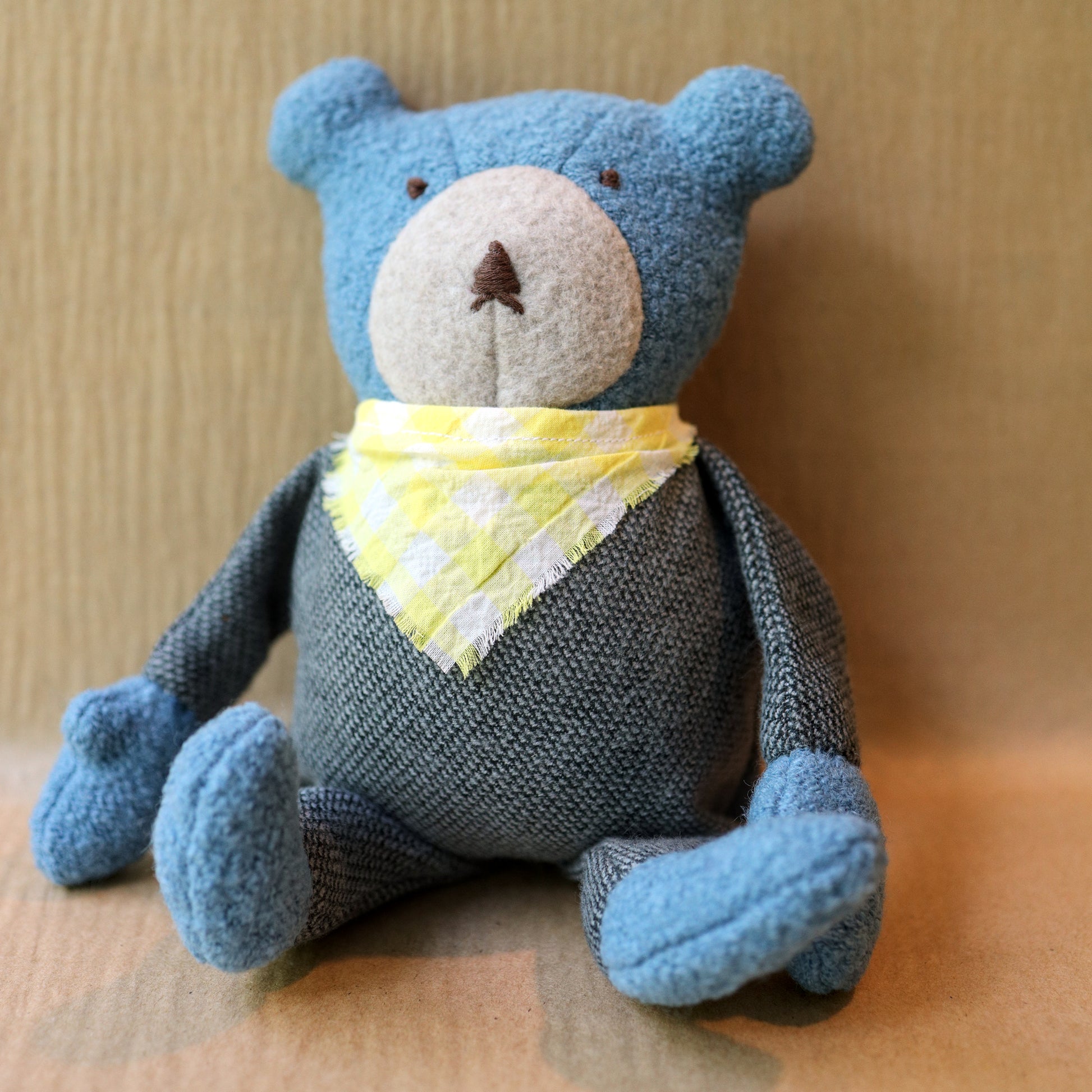 Berry the Floppy Teddy in pepper pajamas and wool boucle