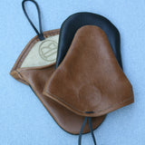 Two brown and black leather oven mitts