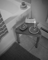 made cozy milking stool dovetailed triangular side table next to bathtub