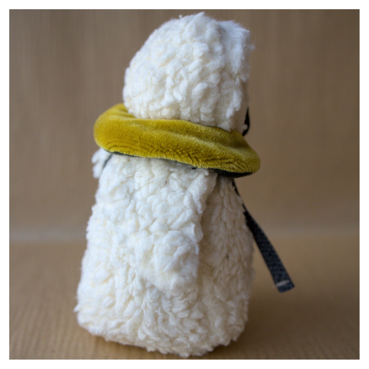 side profile of sherpa teddy fabric owl cotton and mohair toy