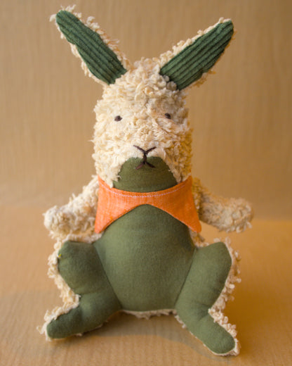 aster cottontail in green and light brown tea dued fabric with a linen pointy collar