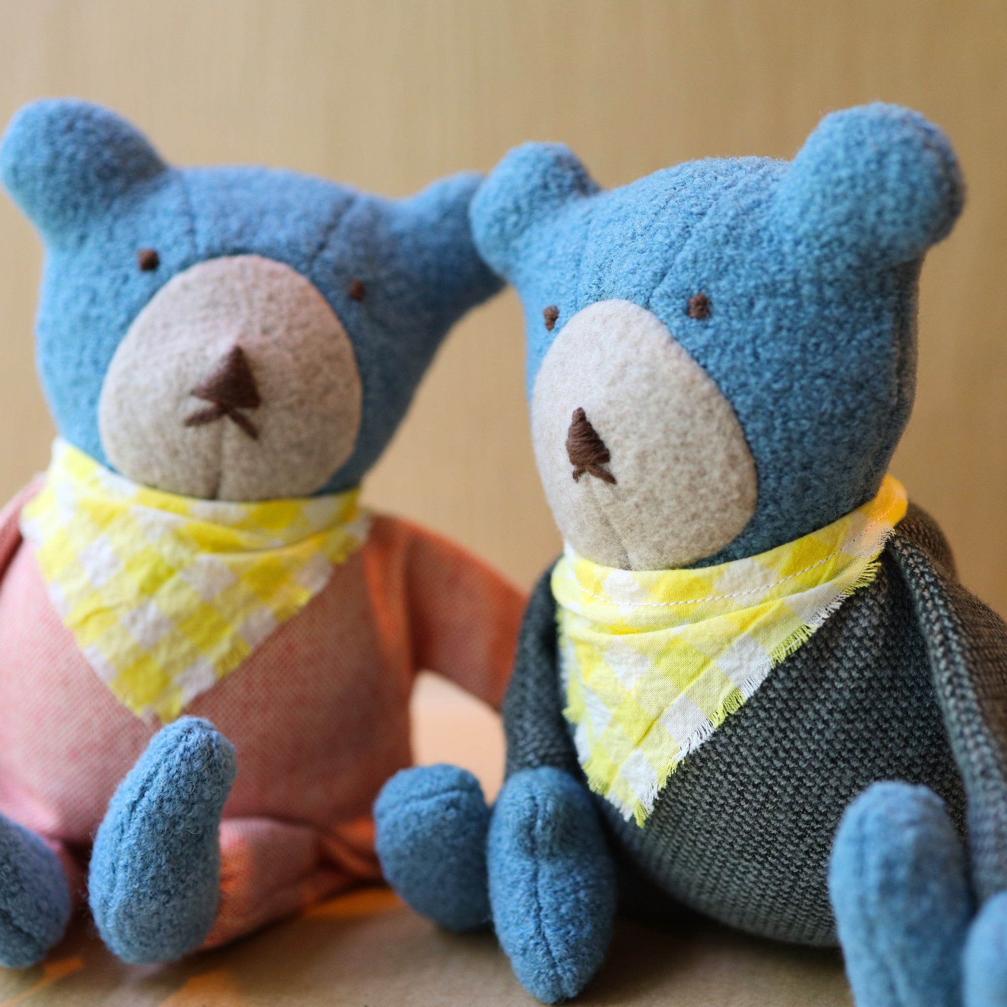 Berry the Floppy Teddy in peach and pepper pajamas and wool boucle