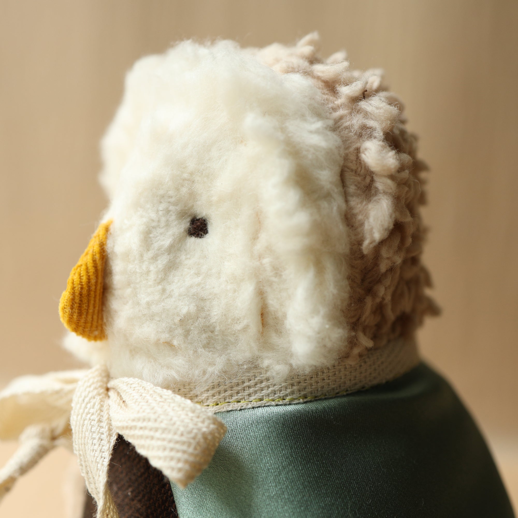 profile of all natural wool cotton and silk owl toy plushie with cape