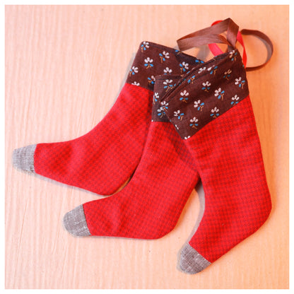 Red stockings with brown floral top on a lbrown background