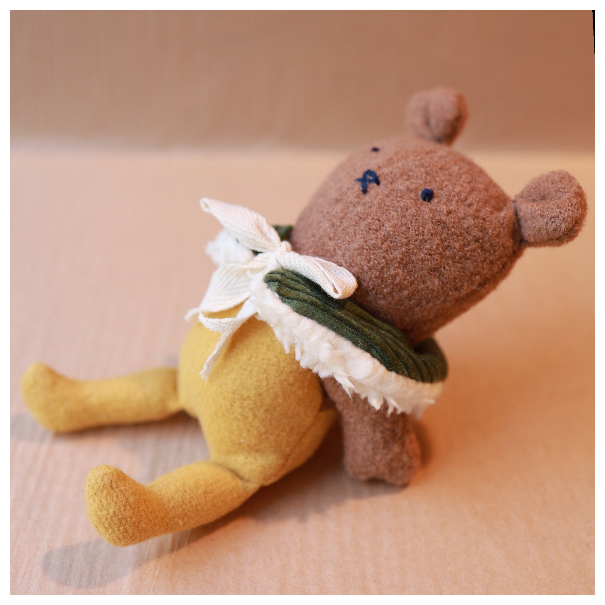 mouse toy with articulating arms leaning back looking up 