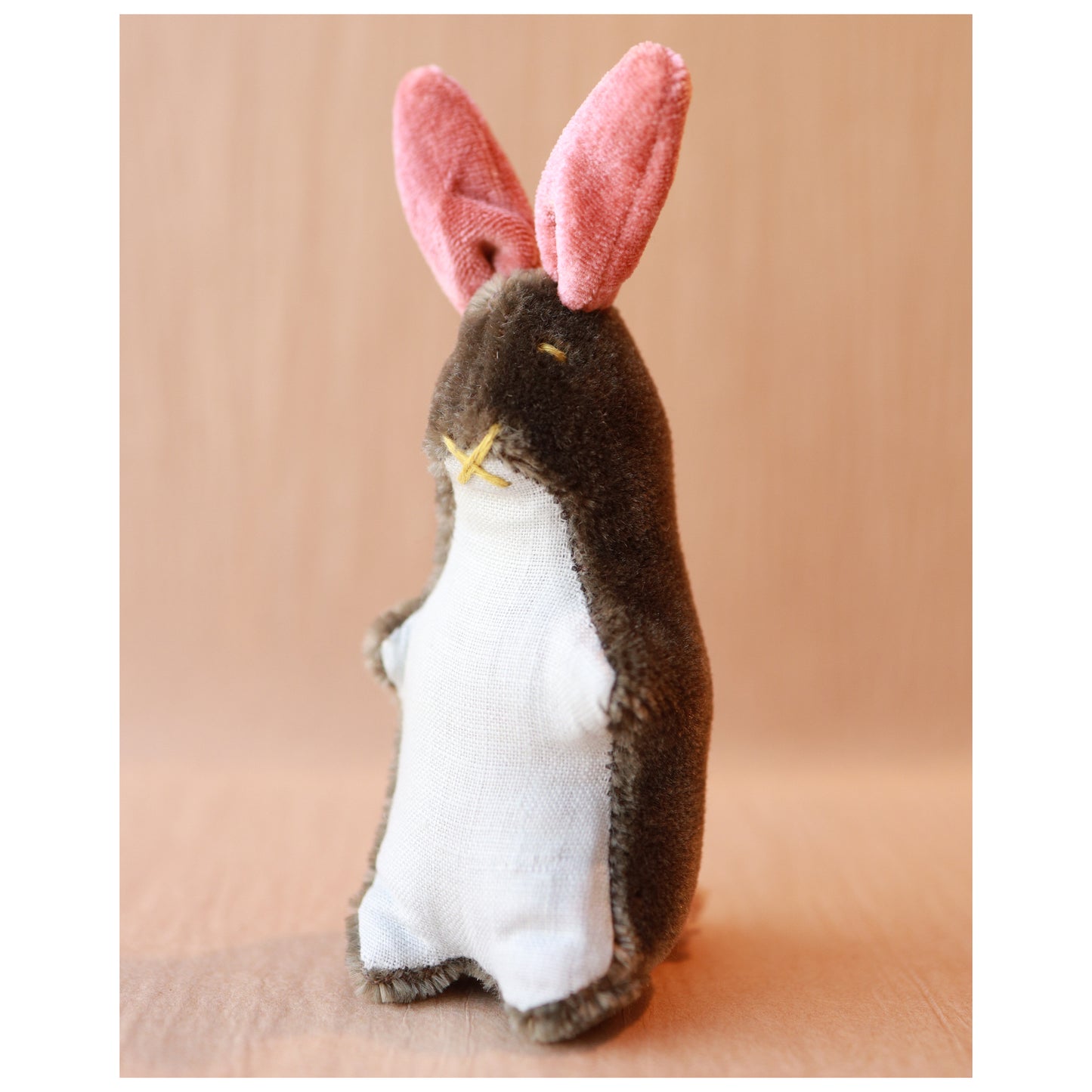 mohair bunny with brown mohair, pink ears, and a light blue linen belly