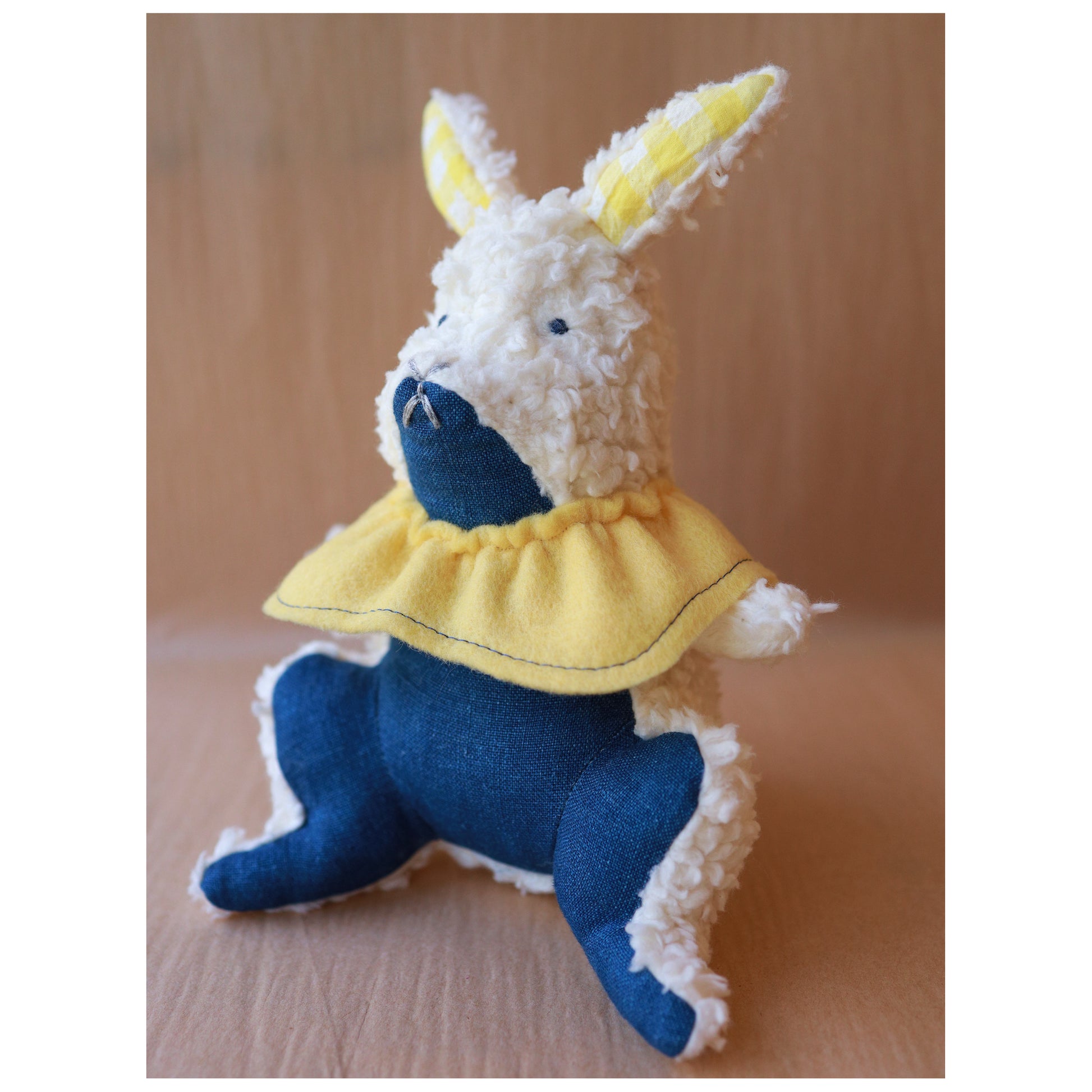 Stuffed toy rabbit with a yellow collar