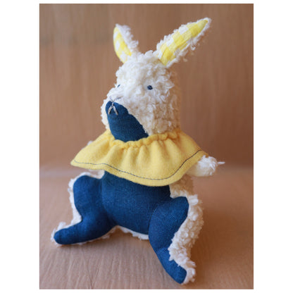 Stuffed toy rabbit with a yellow collar
