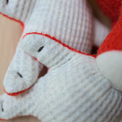 Close up of mini fox toy made from red terrycloth, fleece and light gray waffle fabric