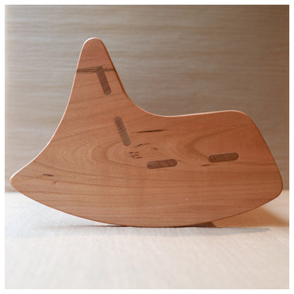 a handmade wooden rocking chair side profile with mortise and tenon joinery showing 