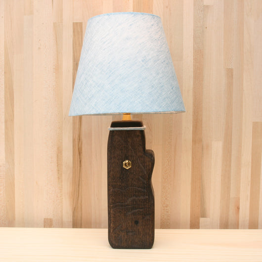 log lamp front, soft blue linen shade, ebonized oak, brass
