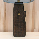 log lamp base, soft blue linen shade, ebonized oak, brass