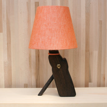 log lamp front, mandarin orange linen shade, ebonized oak, brass