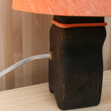 log lamp back, mandarin orange linen shade, ebonized oak, brass