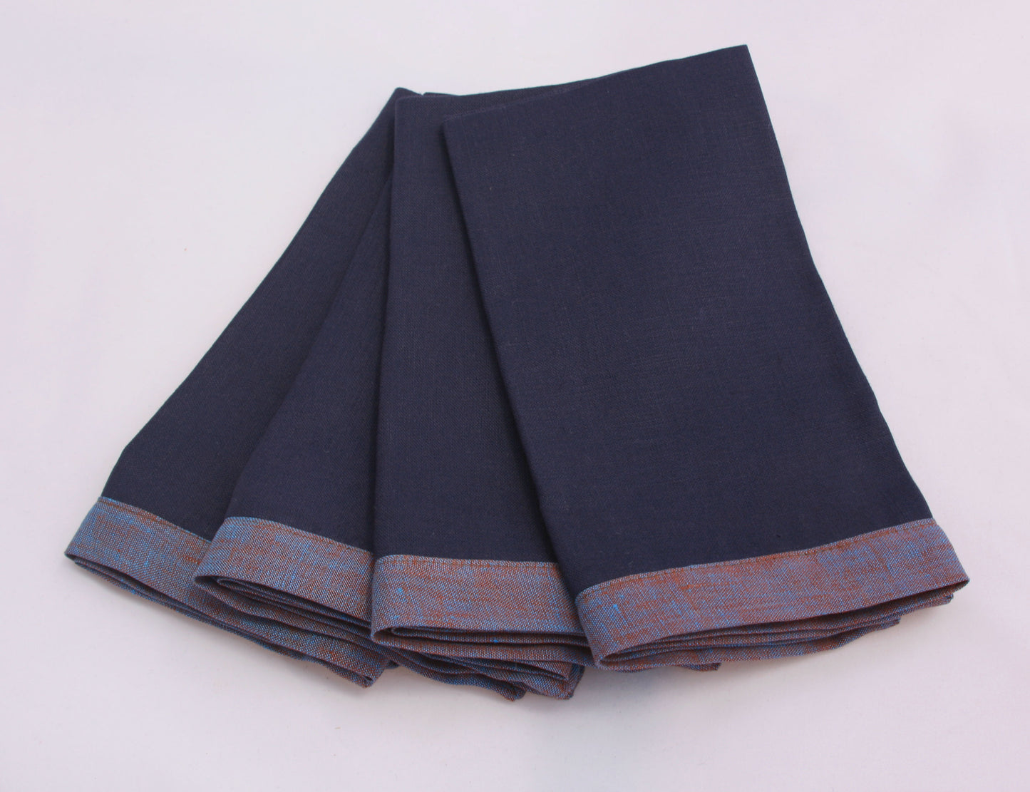 Set of 4 of blueberry blue and reddish blue bordered linen napkins. Picture frame mitered corner boarder.