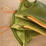 Green leather oven mitt close