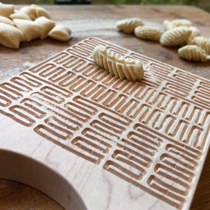 Homamade Pasta board cavatelli, maze, close up, texture