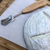 bread lame with sourdough loaf, slash, score, kitchen tool